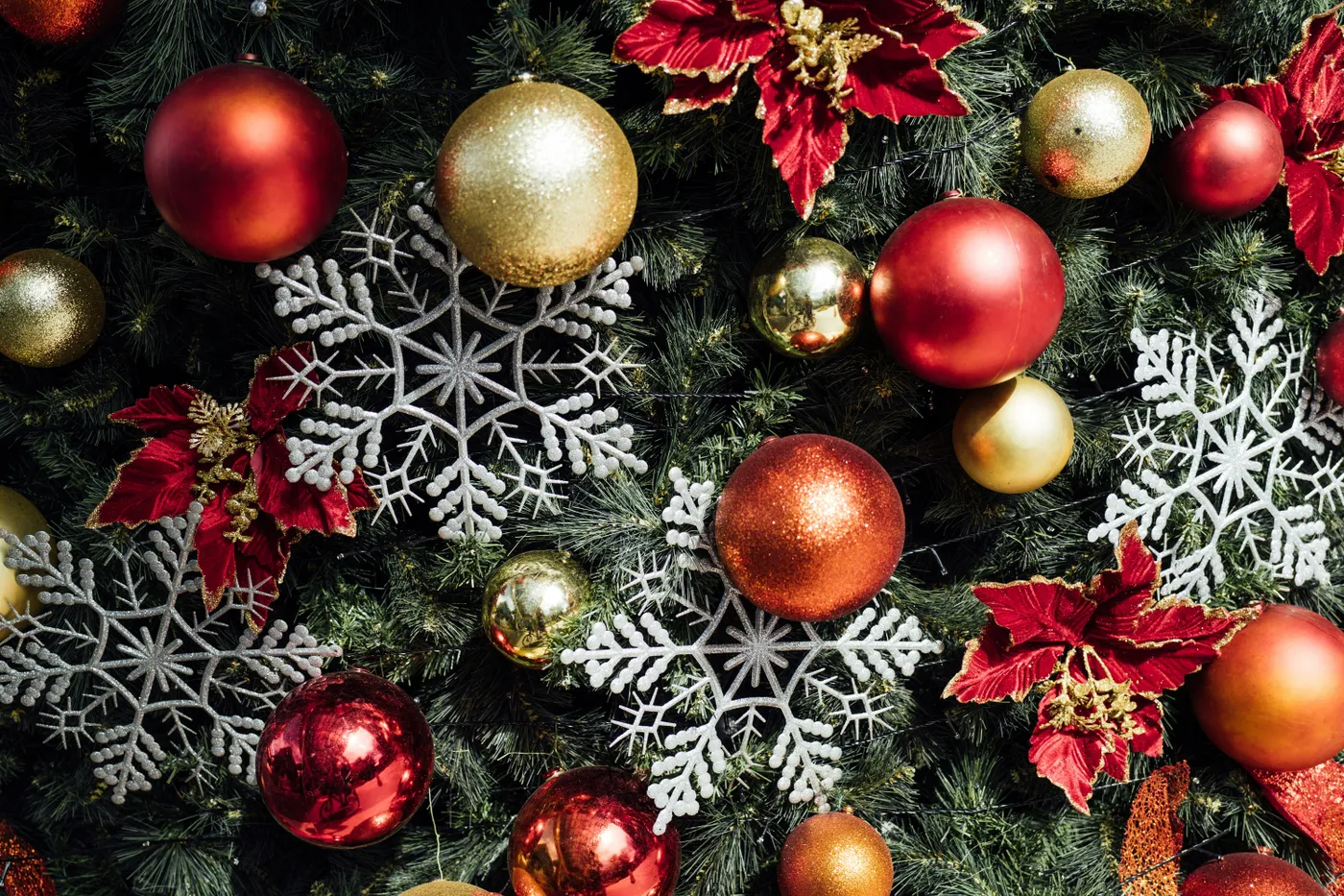 a christmas tree with red and gold ornaments