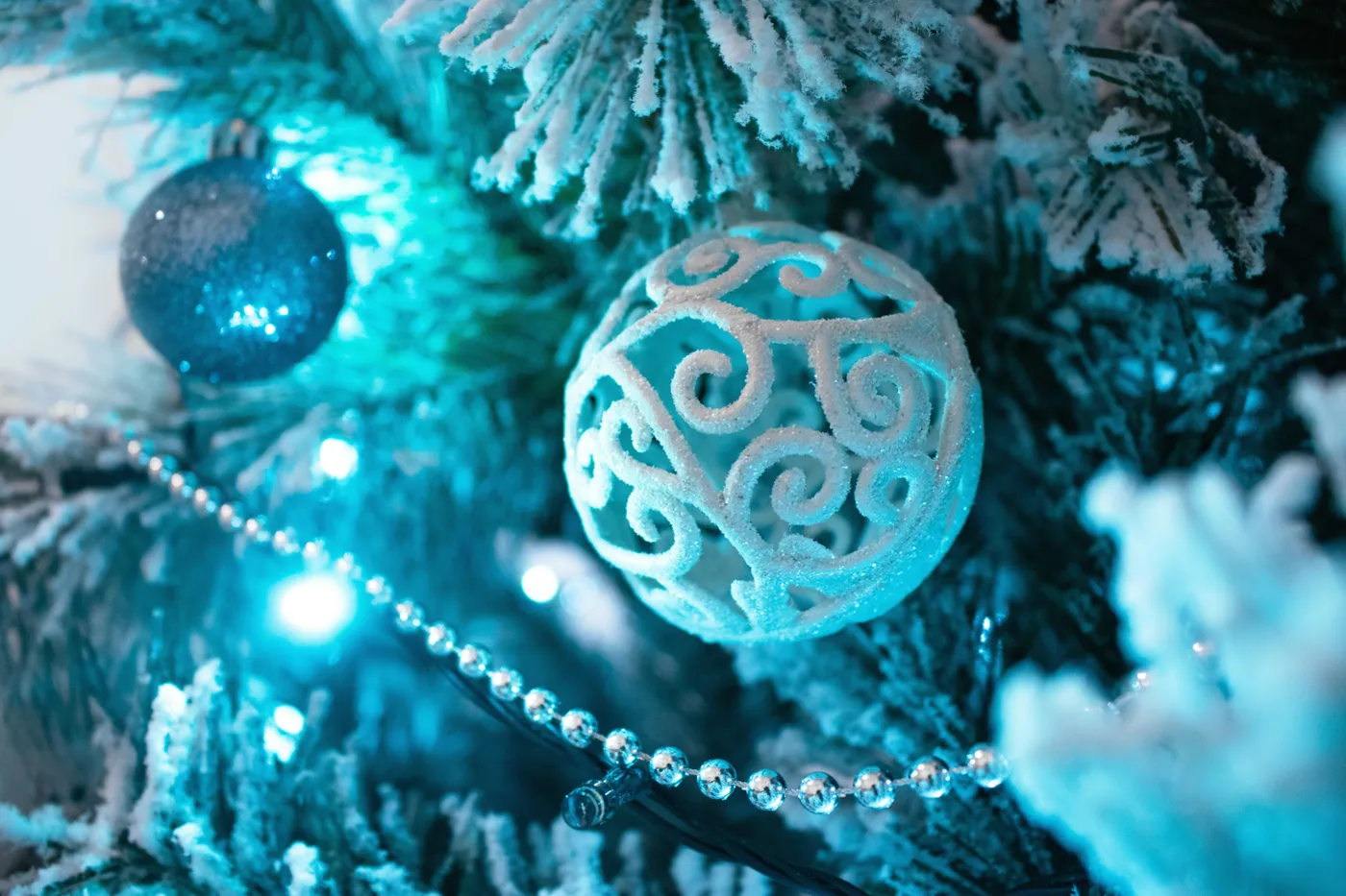 a close up of a christmas tree with ornaments
