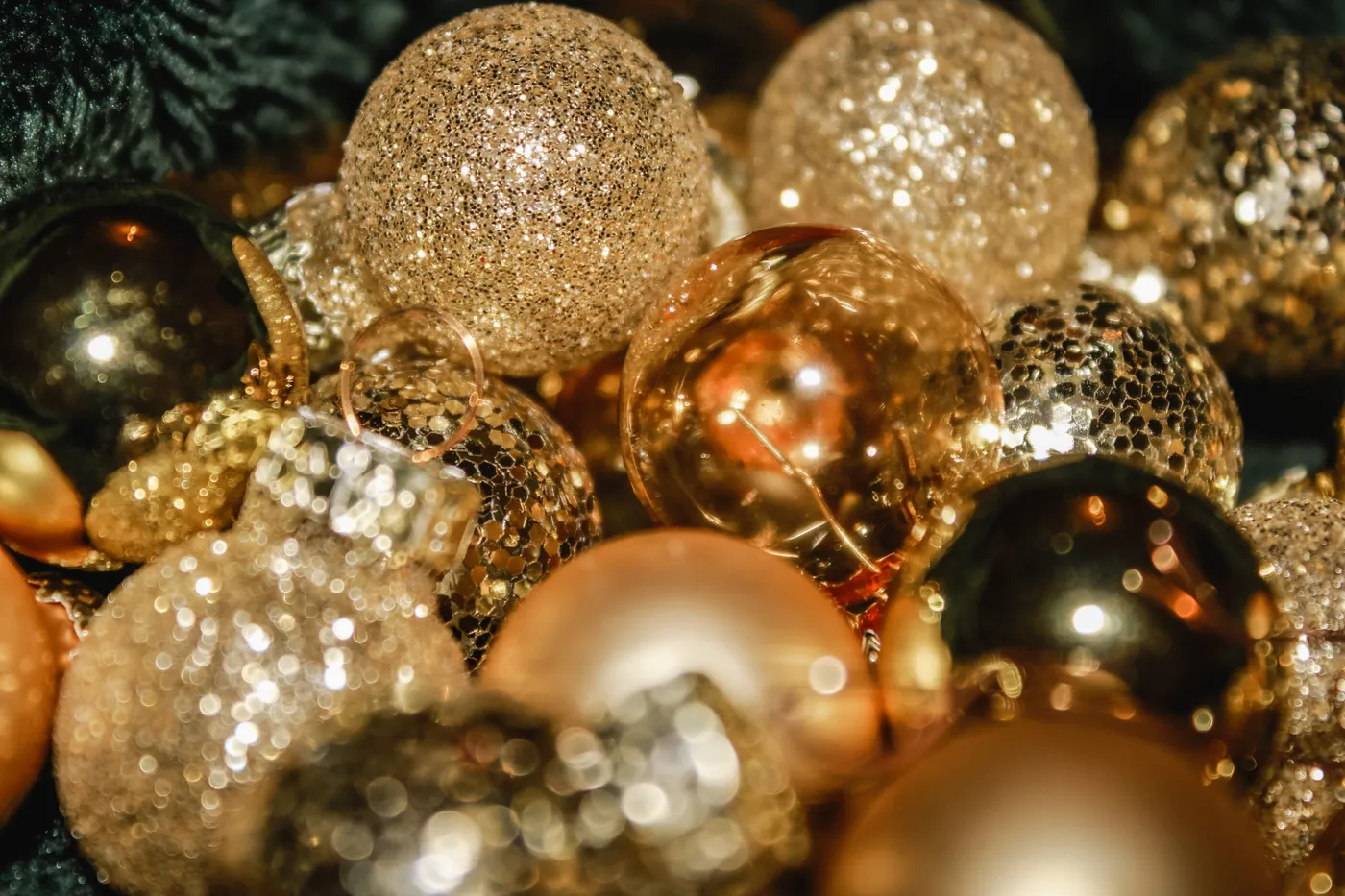 A close-up of shimmering golden Christmas ornaments, ideal for festive decor concepts.