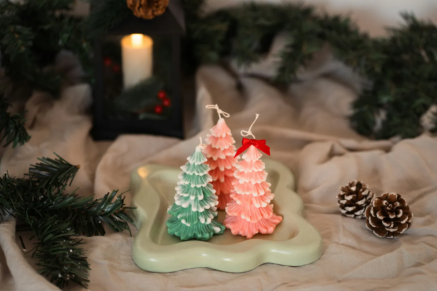 A couple of small christmas trees sitting on top of a table