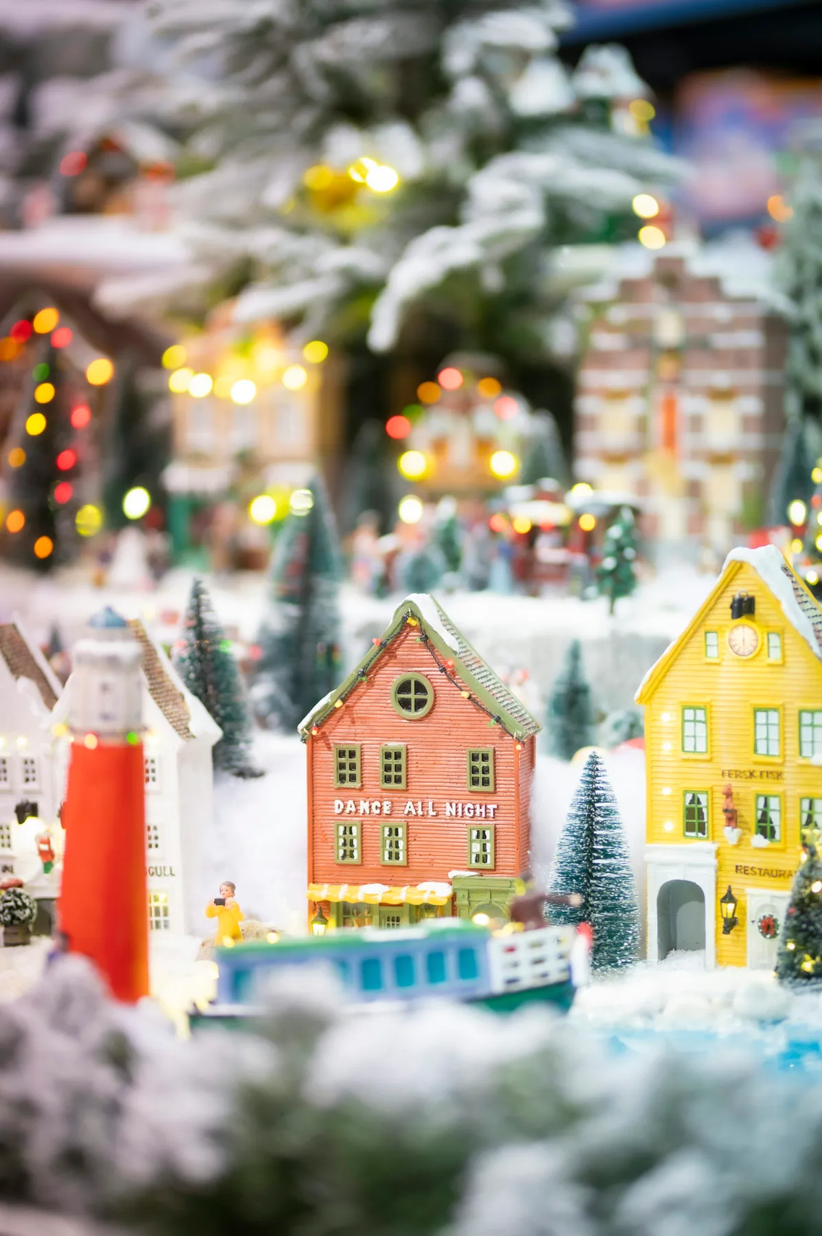 A display of christmas village decorations on a table - Free Photo on  Unsplash