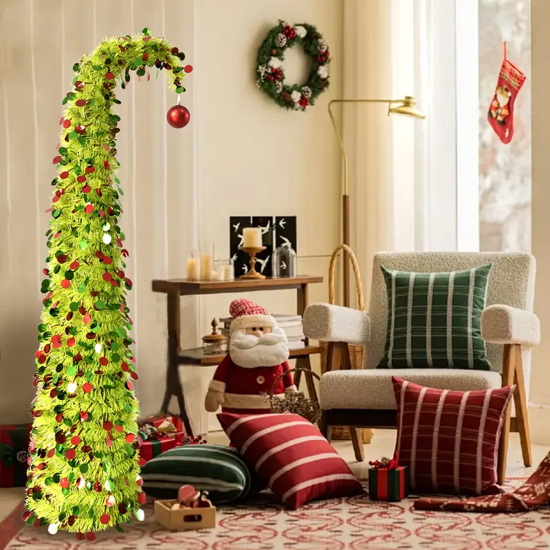 A Single * Christmas Tree * with *-Green Tinsel, Red And Green Sequins, And a Ball on Top. Easy to Assemble, It * a * Impression! Fun, Whimsical, And Bursting with Festive Spirit—* Decorations, 'S .