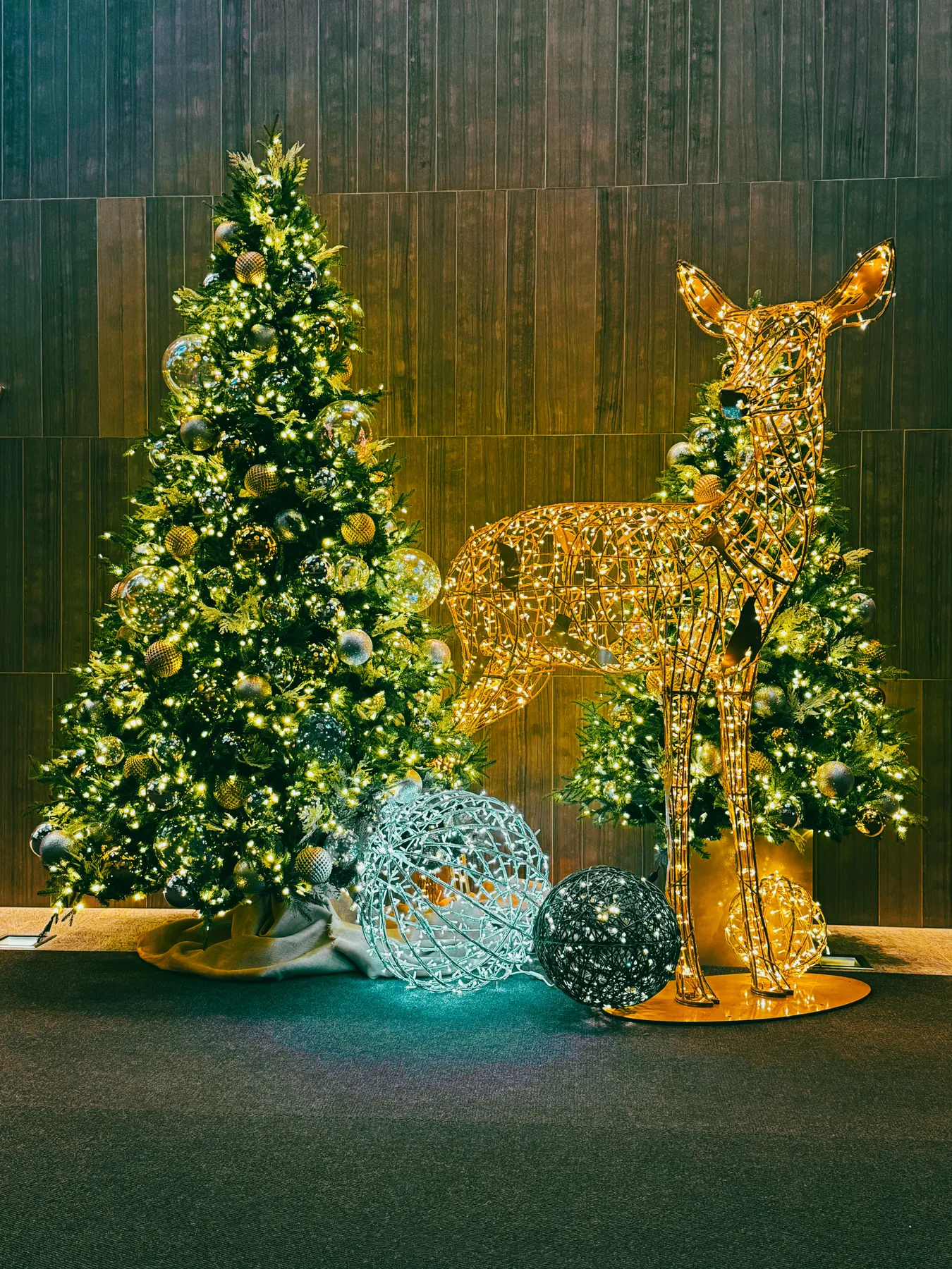 Beautiful festive scene with Christmas trees and an illuminated deer in Toronto, Canada.