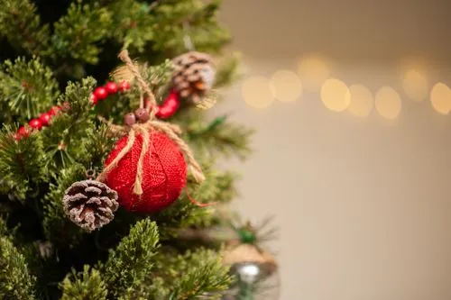 Close-Up of Ornaments Hanging on a Christmas Tree · Free Stock Photo