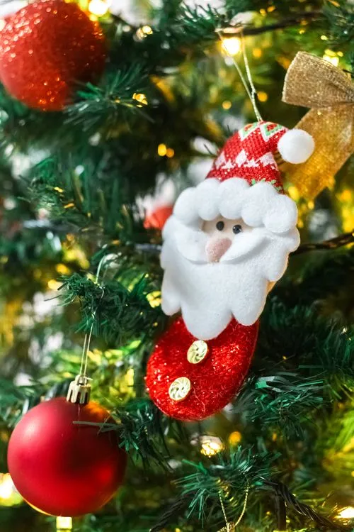Close-Up Shot of Santa Claus Decoration Hanging on a Christmas Tree · Free  Stock Photo
