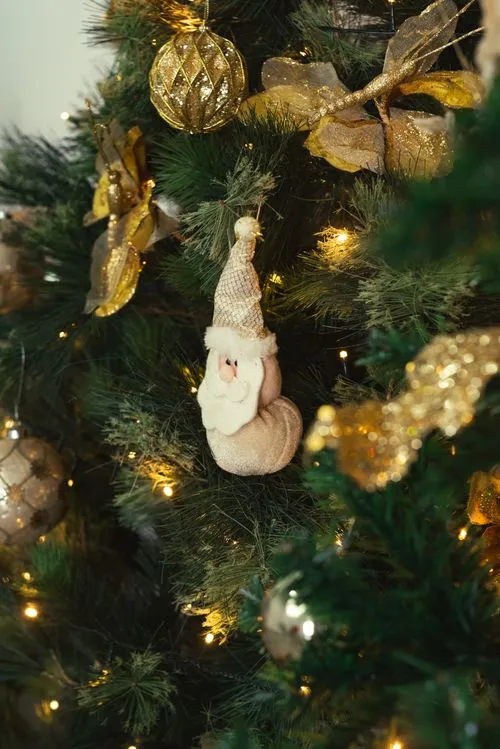 Close-Up Shot of Santa Claus Decoration Hanging on a Christmas Tree · Free  Stock Photo