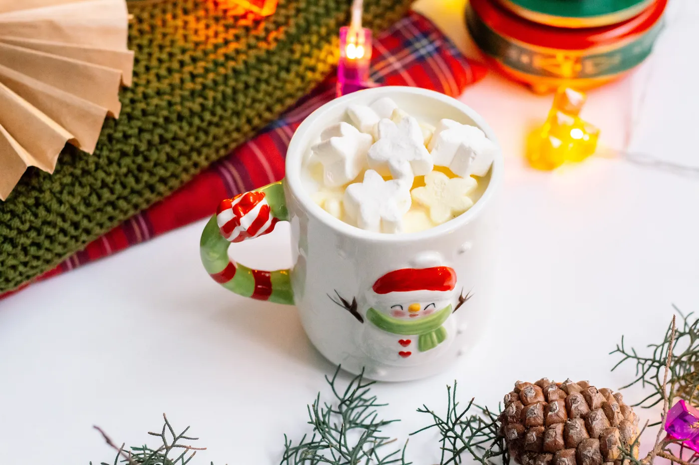Cozy holiday setup with hot chocolate and festive decorations. Perfect for winter vibes.