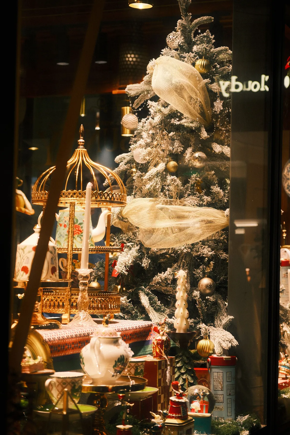 Festive Christmas tree and decor in a Guangzhou storefront showcasing elegance.
