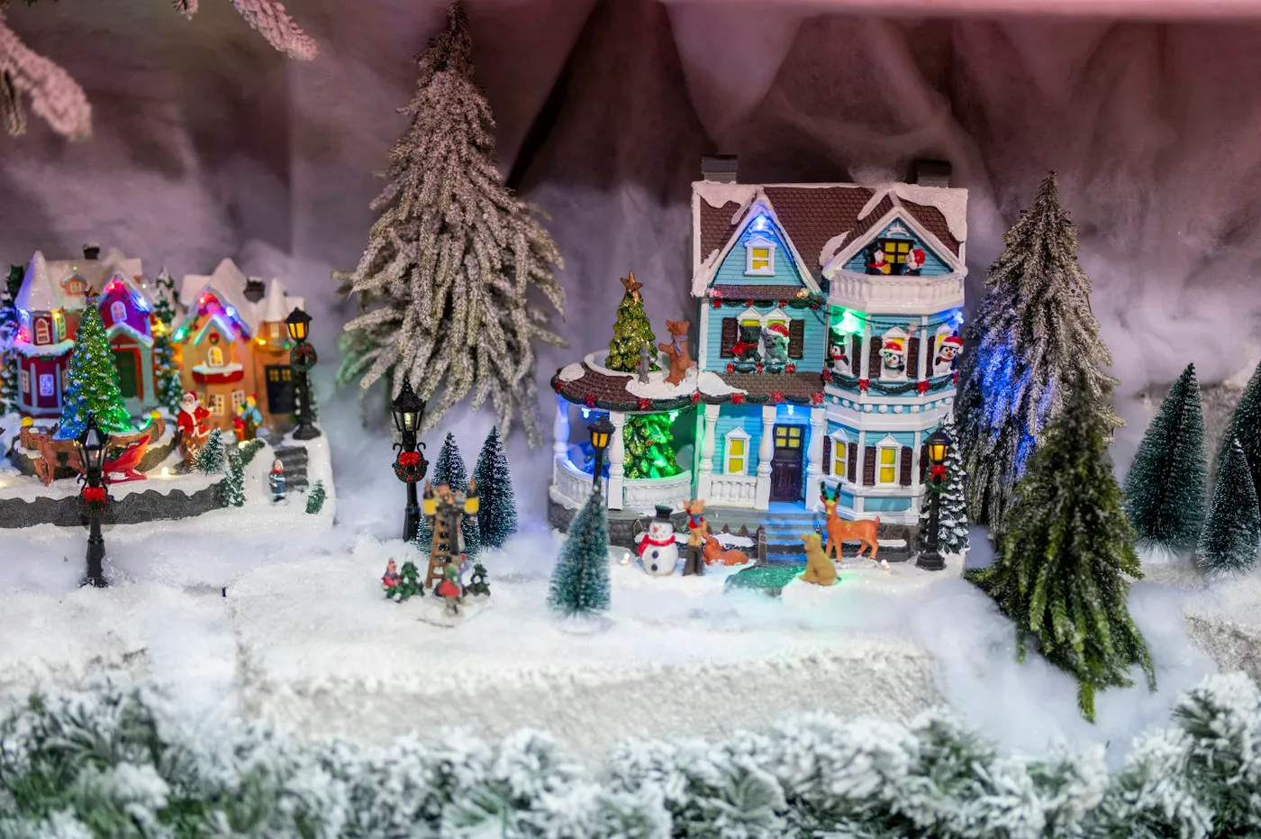 Miniature village scene with snow and christmas lights - Free Photo on  Unsplash