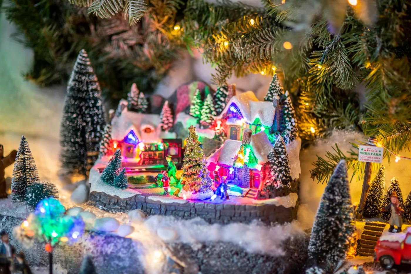 Miniature village scene with snow and christmas lights - Free Photo on  Unsplash