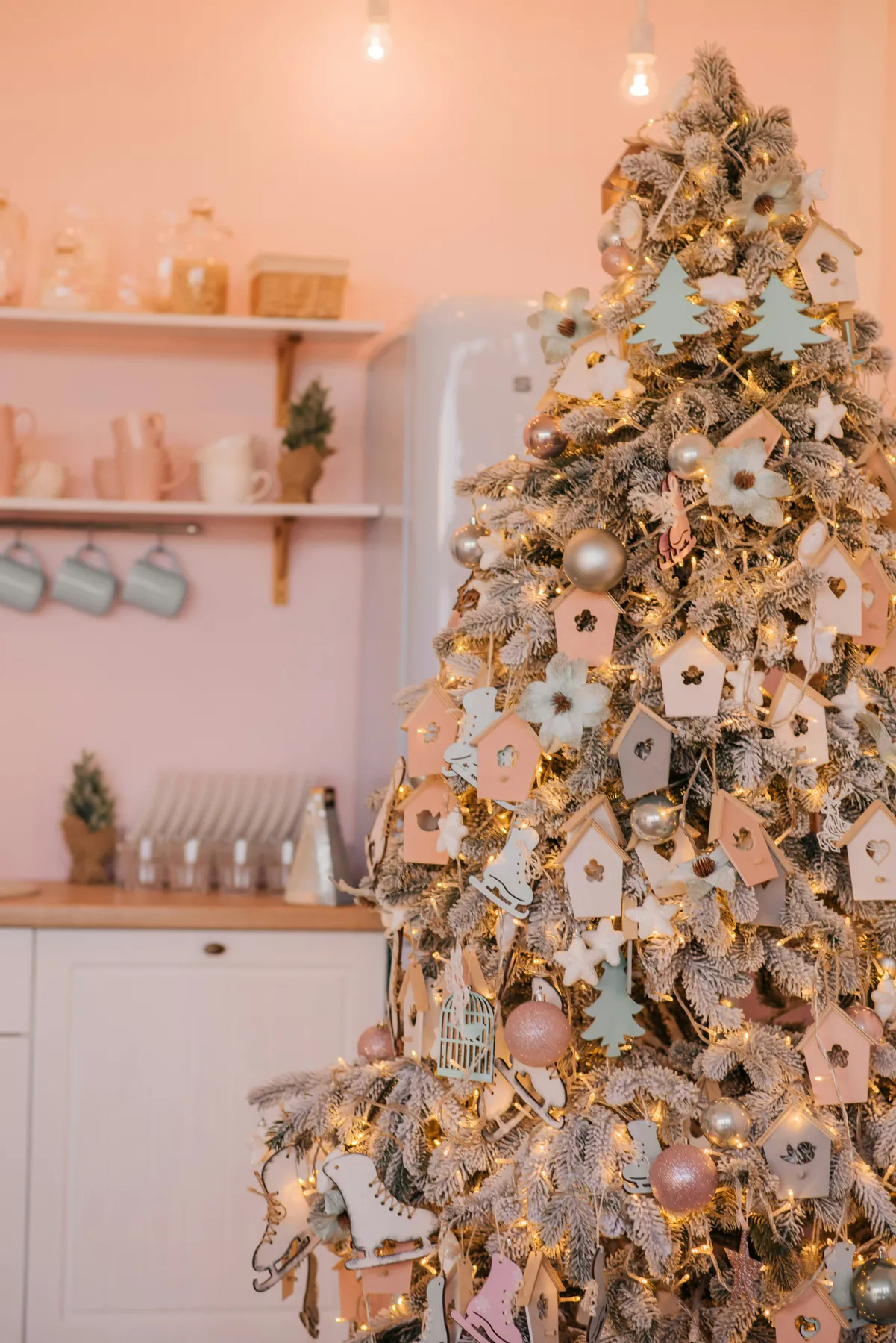 silver and gold baubles on white wall