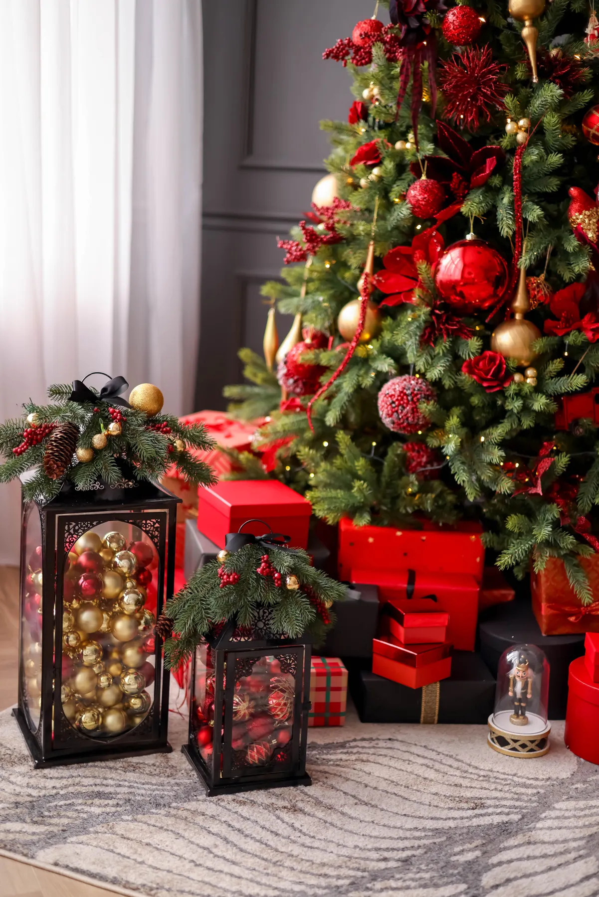 Vibrant Christmas tree adorned with ornaments, surrounded by wrapped gifts and festive decor.