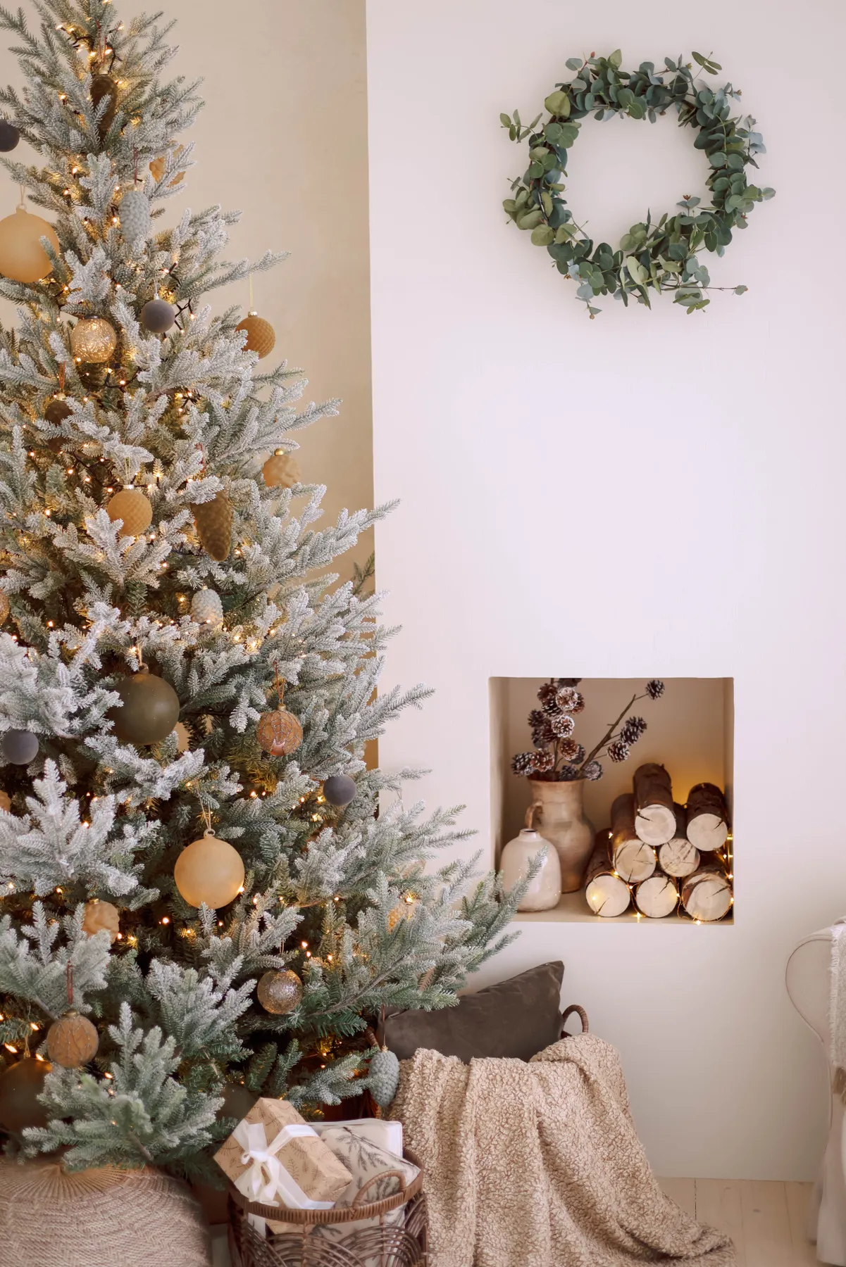 Warm and inviting living room with a decorated Christmas tree and presents.