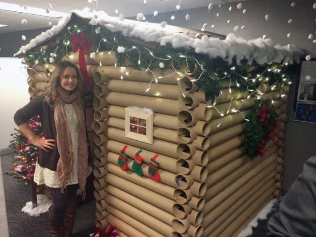 Woman transforms her work cubicle into a cosy log cabin for Christmas | Metro News